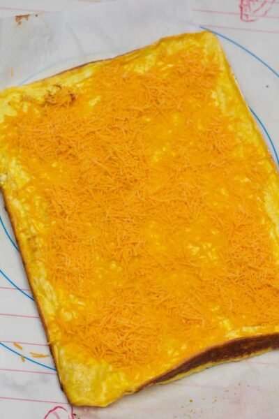 图5烤鸡蛋，上面放一杯碎奶酪。gydF4y2Ba